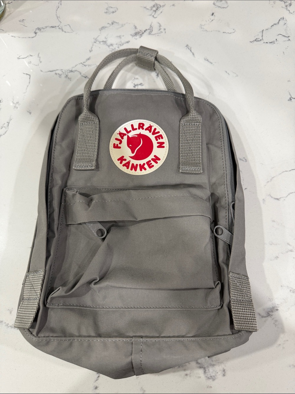 Fjallraven Kånken Mini Backpack in Gray with Red Logo